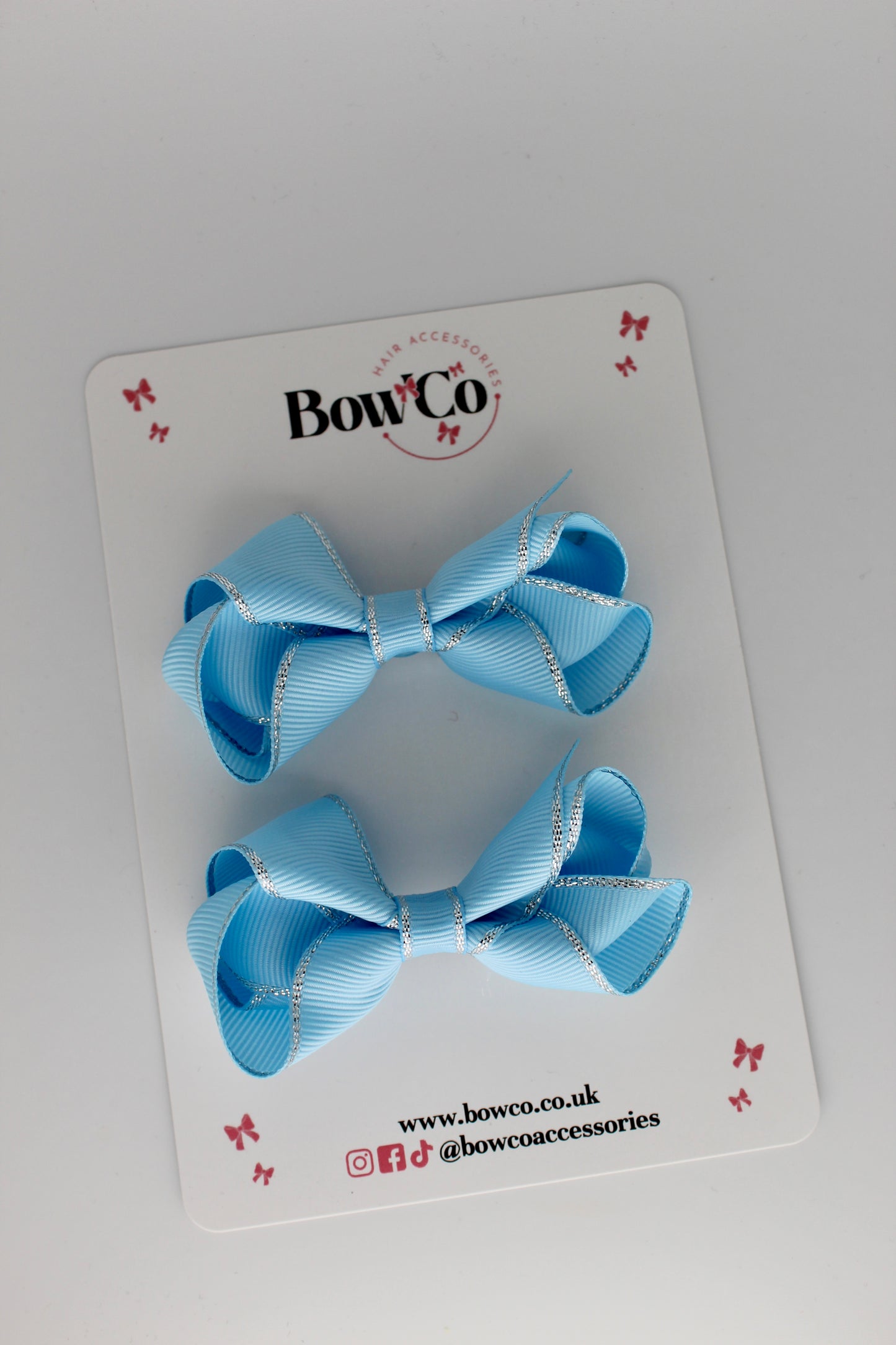 3 Inch Twist Bow with silver edging - Pastel Blue - Clips